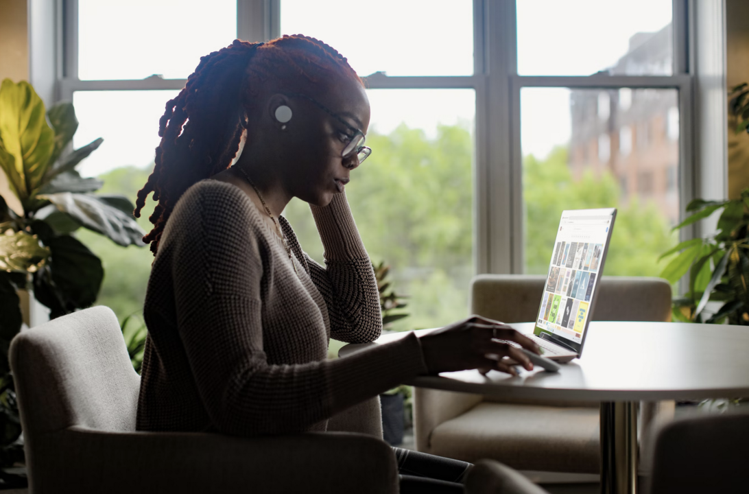(c) Surface. A remote worker working on her PC