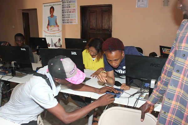 youth learning computer at develop africa sierra leone computer lab