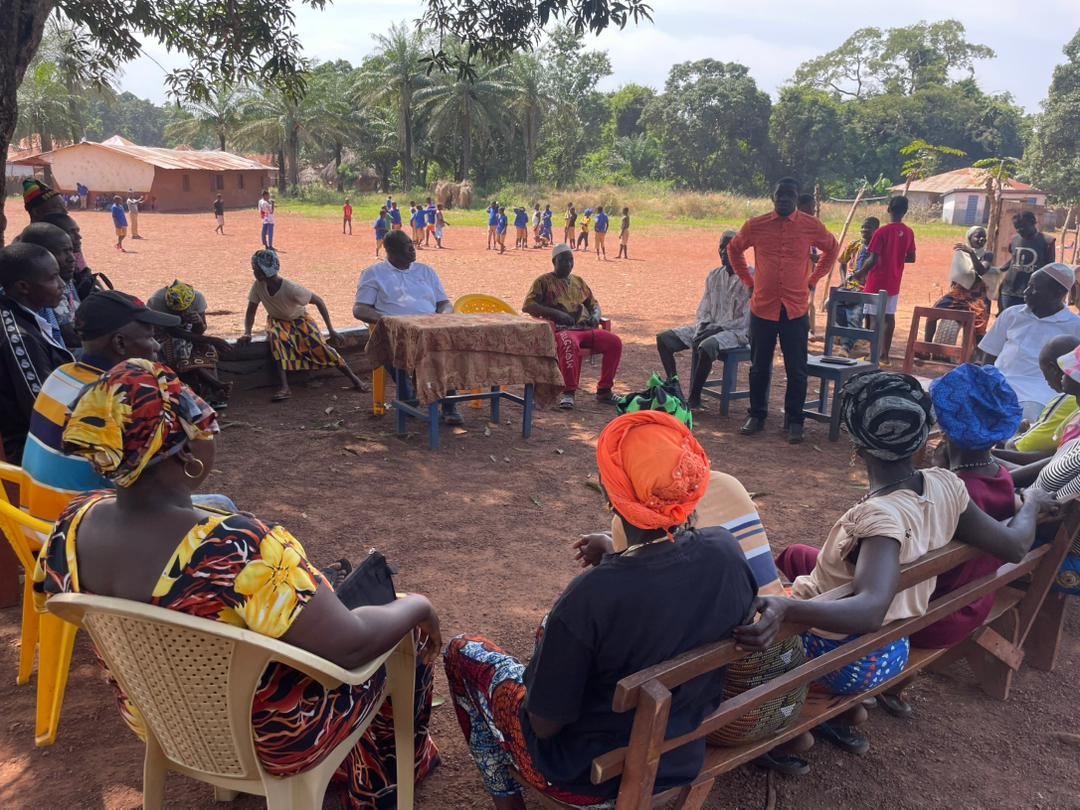 Sylvester and the elders of Kamawornie village are in a gathering