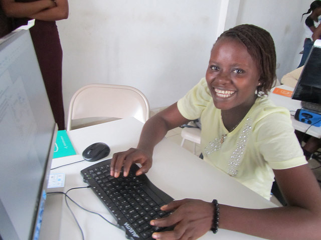 a lady at develop africa sierra leone computer lab
