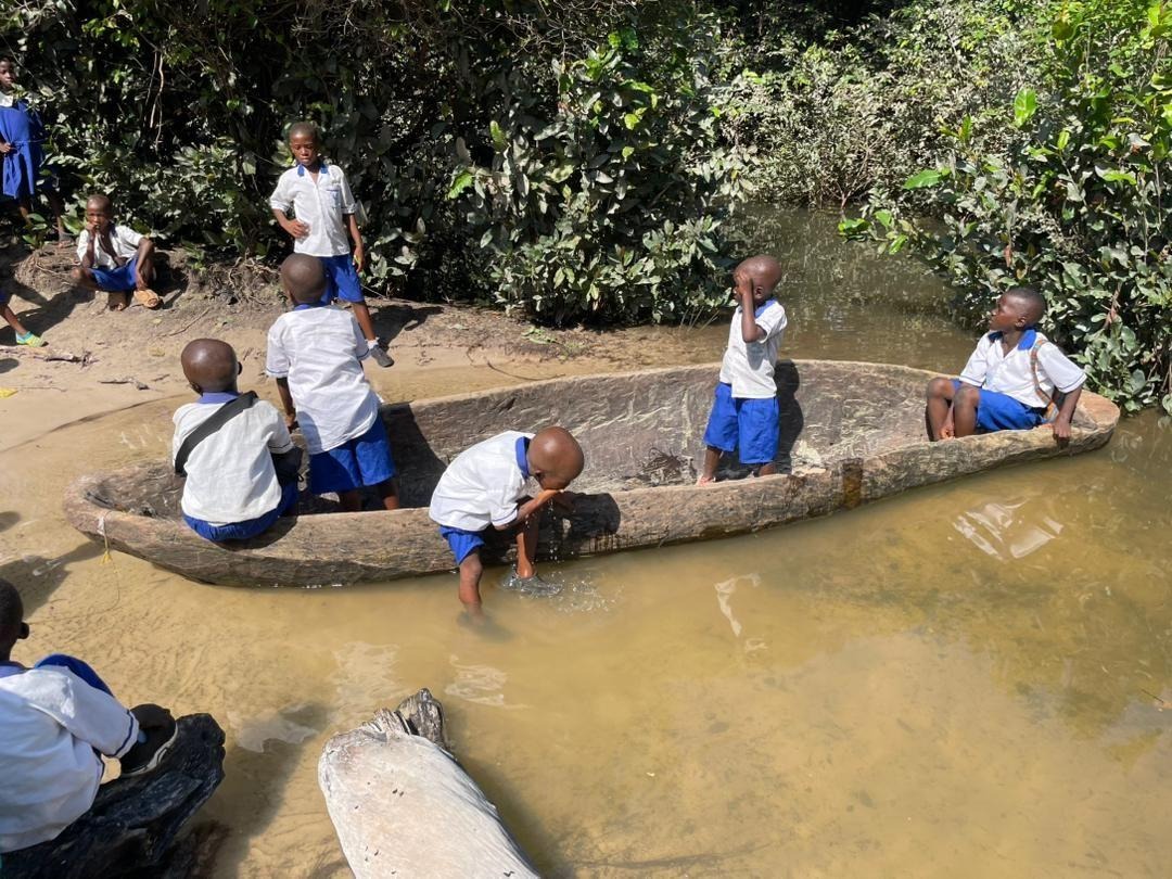 The dugout canoe students use to cross the river on their way to school