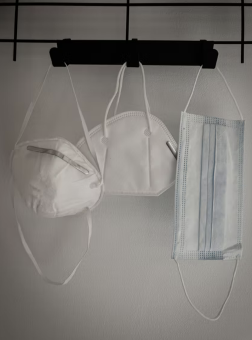 nose masks hanging on a shelf